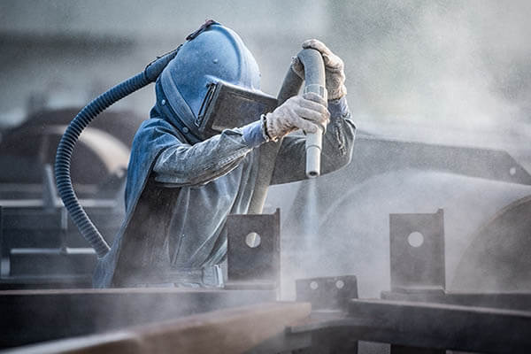 Abrasive blasting dusts are dangerous and can cause a multitude of serious health risks.